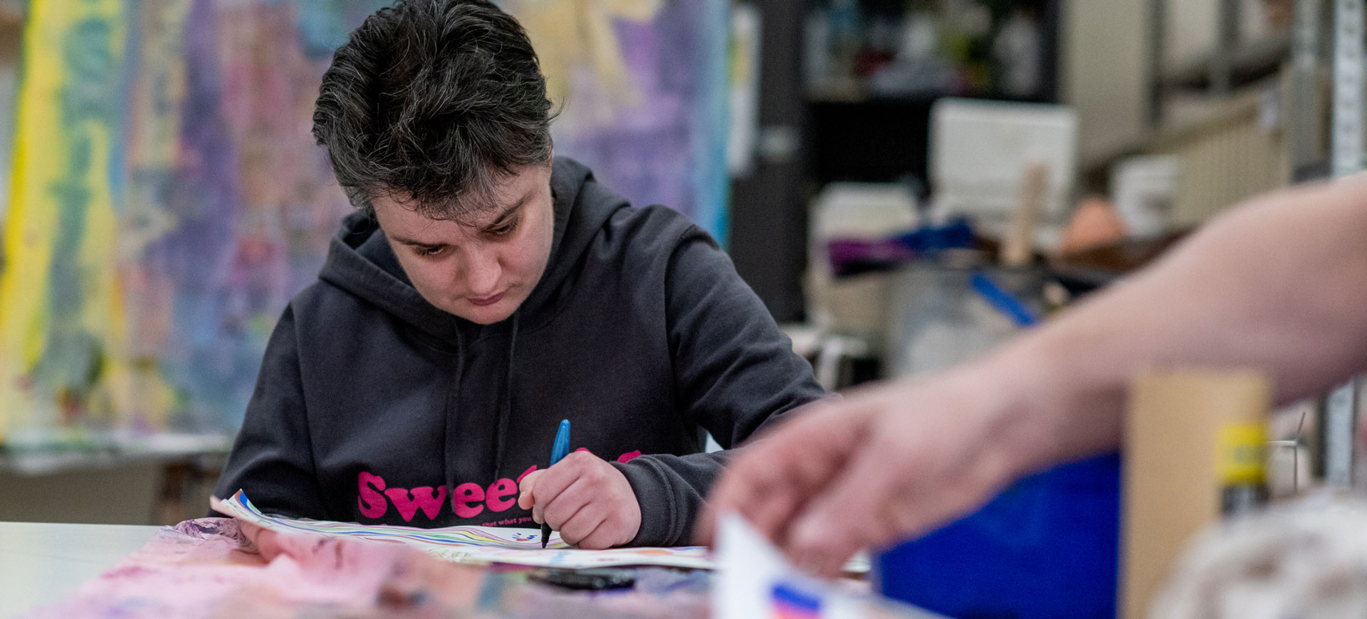 photo of a woman drawing in Araluen Art Connects Program Melbourne